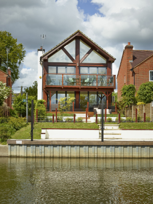 photo of house with riverside views